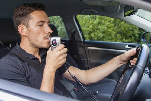 Person taking breathalyzer test