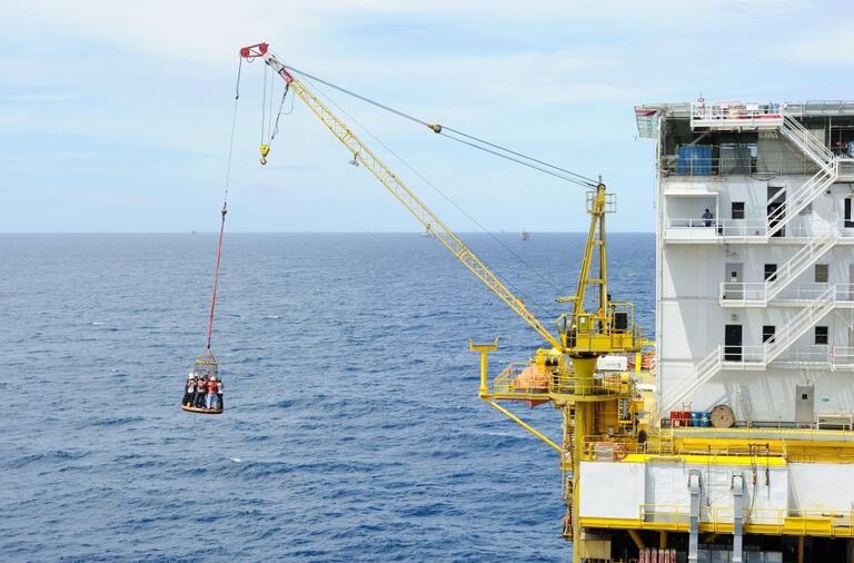 offshore workers over water