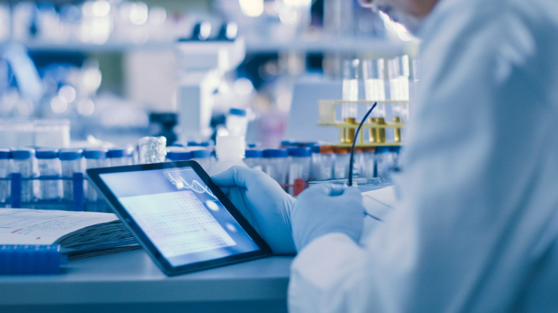 Research Scientist is Using a Tablet in a Modern High-Tech Laboratory.